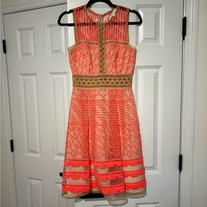 Jonathon Simkhai beige and neon knee length dress.